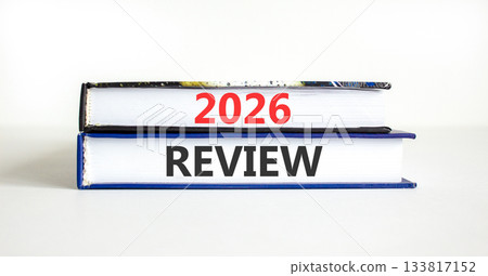 2026 Review symbol. Concept words 2026 Review on beautiful books. Beautiful white paper background. Business and 2026 review concept. Copy space. 133817152