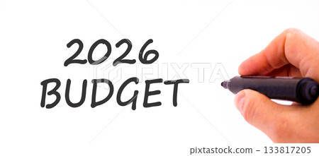2026 Budget symbol. Concept words 2026 Budget on beautiful white paper. Beautiful white paper background. Businessman's hand with pen. Business and 2026 budget concept. Copy space. 2026 Budget symbol. Concept words 2026 Budget on beautiful white paper. Beautiful white paper background. Businessman's hand with pen. Business and 2026 budget concept. Copy space. 133817205