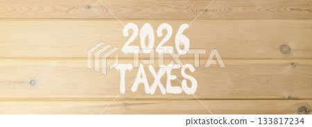 2026 taxes new year symbol. Concept words 2026 taxes on beautiful wooden wall. Beautiful wooden wall background. Business and 2026 taxes new year concept. Copy space. 133817234