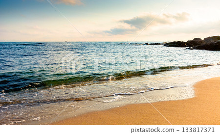panoramic view of sand beach in bulgaria landscape. summer vacation season at the black sea on a sunny day. beautiful seaside of sozopol with calm water. wide coast travel banner panoramic view of sand beach in bulgaria landscape. summer vacation season at the black sea on a sunny day. beautiful seaside of sozopol with calm water. wide coast travel banner 133817371