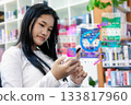 Woman Using Smartphone for Online Shopping with Digital Icons and Promotion Interface 133817960