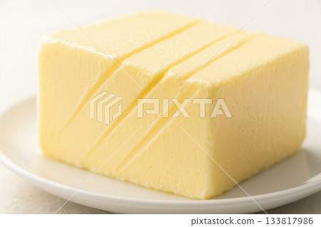 Creamy Butter Block With Clean Slices On White Plate Creamy Butter Block With Clean Slices On White Plate 133817986