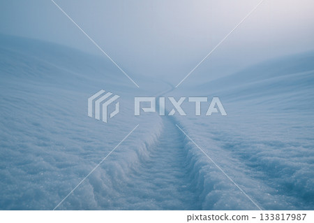 Lonely Snow Trail Leading Into Misty Winter Hills Lonely Snow Trail Leading Into Misty Winter Hills 133817987