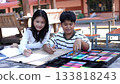 Asian Children Drawing Together Outdoors with Art Supplies and Color Set 133818243