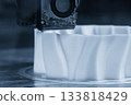 Close up scene the 3D model operation by additive manufacturing by 3D printer machine in the blue scene tone. 133818429