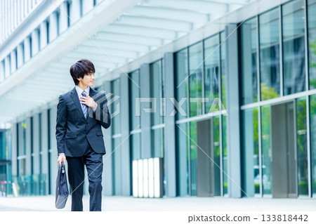 young man wearing a suit young man wearing a suit 133818442