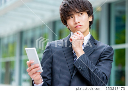 Businessmen using smartphones 133818473
