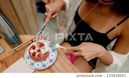 Savoring a Delightful and Delicious Dessert in a Cozy and Inviting Cafe Atmosphere 133818691