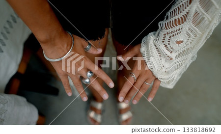 Elegant Hands Beautifully Adorned with an Array of Stylish and Trendy Jewelry Pieces 133818692