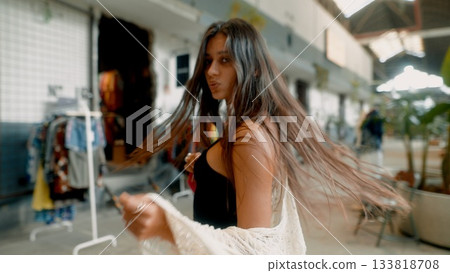 A Stunning Fashion Model Posing in an Urban Setting with Beautiful, Flowing Hair A Stunning Fashion Model Posing in an Urban Setting with Beautiful, Flowing Hair 133818708
