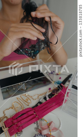 Exploring the Jewelry Display and Selection Process within a Realm of Colorful Accessories Exploring the Jewelry Display and Selection Process within a Realm of Colorful Accessories 133818785