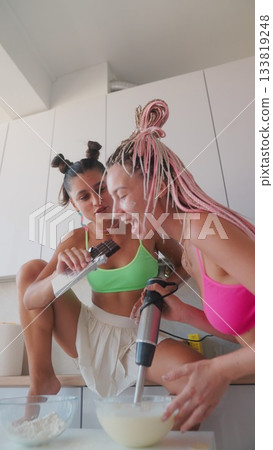 Enjoy a Fun Cooking Experience with Your Friends in a Bright and Modern Kitchen Setting Enjoy a Fun Cooking Experience with Your Friends in a Bright and Modern Kitchen Setting 133819248