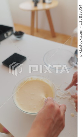 Capturing the Art of Mixing a Delicious and Creamy Batter for Baking and Cooking Delights 133819354