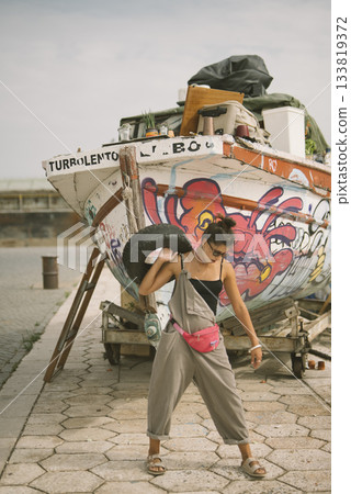 Experience the Vibrant Street Art and Bold Fashion located right by the beautiful Harbor 133819372