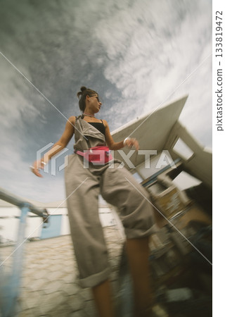 Candid Style Fashion Snapshot Captured in an Urban Setting with a Beautiful Cloudy Sky Candid Style Fashion Snapshot Captured in an Urban Setting with a Beautiful Cloudy Sky 133819472