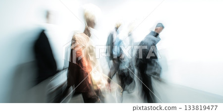 Diverse individuals move creating streaks of colorful motion against a light background. Blurred people banner 133819477