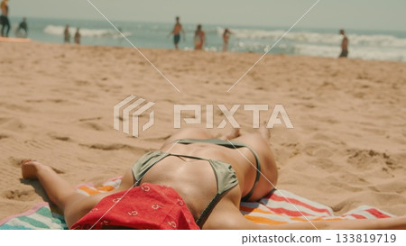 Experience the joy of relaxation at a sunny beach, filled with refreshing summer vibes Experience the joy of relaxation at a sunny beach, filled with refreshing summer vibes 133819719