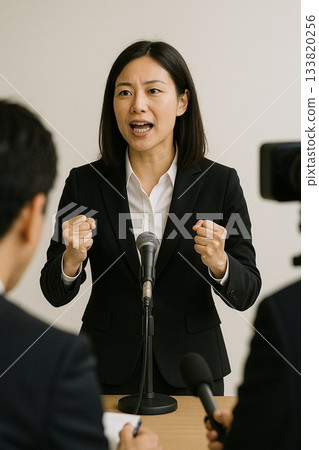 A woman giving a speech with great enthusiasm A woman giving a speech with great enthusiasm 133820256