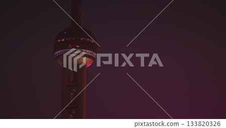 Close-up view of iconic Oriental Pearl Tower illuminated at night. Close-up view of iconic Oriental Pearl Tower illuminated at night. 133820326