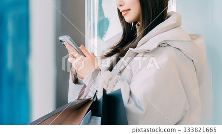 Woman shopping in the winter city 133821665