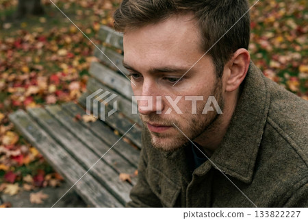 Man Sitting on Bench in Park Man Sitting on Bench in Park 133822227