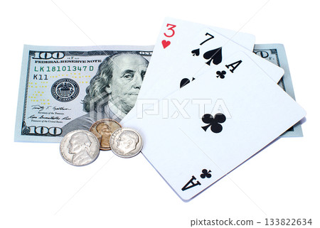 Banknote of one hundred dollars, coins and playing cards isolated on a white background Banknote of one hundred dollars, coins and playing cards isolated on a white background 133822634