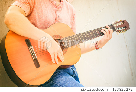Trendy guy with guitar outdoor Trendy guy with guitar outdoor 133823272