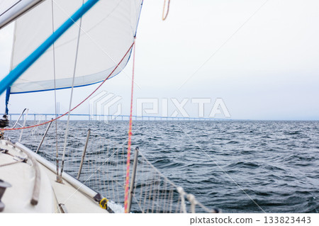 Yacht and oresund bridge between denmark sweden 133823443