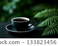 Fern leaves and black cup of coffee 133823456