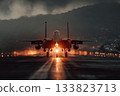 a fighter jet accelerates on the runway at sunset 133823713