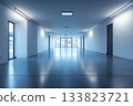 a long, bright, empty corridor with glass doors at the end 133823721