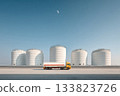 A fuel tanker truck heads towards an oil depot with large white tanks.Transportation of oil and petroleum products 133823726