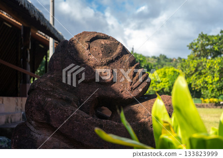 Ancient tiki statue in Atuona, Hiva Oa, Marquesas Islands, French Polynesia Ancient tiki statue in Atuona, Hiva Oa, Marquesas Islands, French Polynesia 133823999