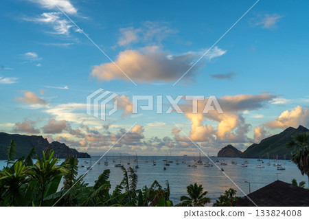 Taiohae Bay at sunset with sailboats in Nuku Hiva, Marquesas Islands, French Polynesia 133824008