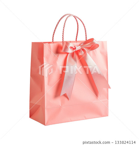 Isolated pink paper bag with satin ribbon on white background 133824114