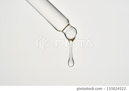 Cosmetic pipette dispensing serum drop for skincare Cosmetic pipette dispensing serum drop for skincare 133824522