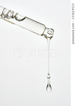 Cosmetic pipette dispensing serum drop liquid skincare product 133824523