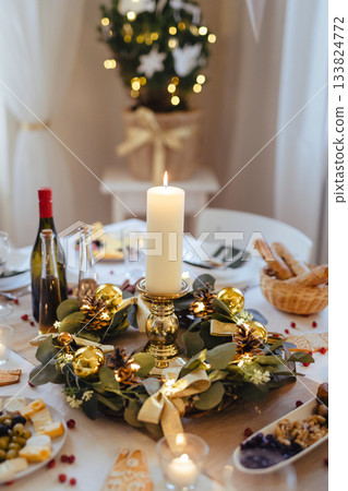 A table set for dinner meal at Christmas time. A table set for dinner meal at Christmas time. 133824772