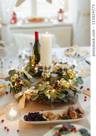 A table set for dinner meal at Christmas time. A table set for dinner meal at Christmas time. 133824773