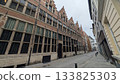 Old brick building with narrow street 133825303