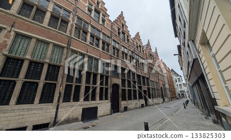 Old brick building with narrow street 133825303