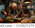 An elderly Asian couple joyfully prepares a healthy meal together in their kitchen, following a personalized nutrition plan tailored to their genetic predispositions and wellness goals. 133825379