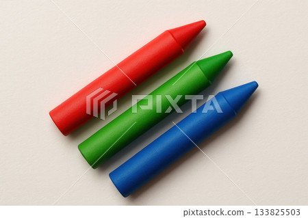 Red Green And Blue Wax Crayons On Clean White Paper Background 133825503