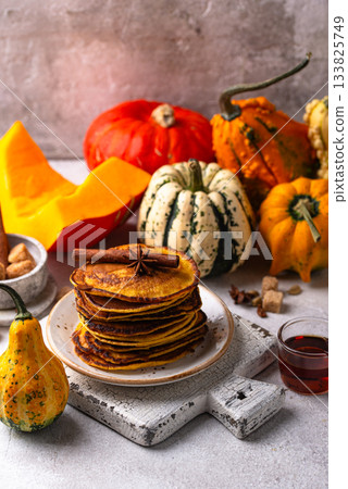 Pumpkin pancakes with maple syrup Pumpkin pancakes with maple syrup 133825749