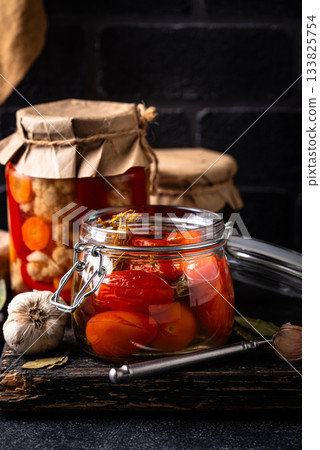 Marinated pickled tomatoes in jar Marinated pickled tomatoes in jar 133825754