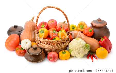 Natural food assortment with pumpkins, peppers, apples and clay pots on white background Natural food assortment with pumpkins, peppers, apples and clay pots on white background 133825821