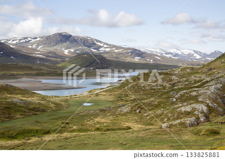 Breathtaking view of Jotunheimen National Park during a hike from Bygdin hotel to Synshorn mountain Breathtaking view of Jotunheimen National Park during a hike from Bygdin hotel to Synshorn mountain 133825881