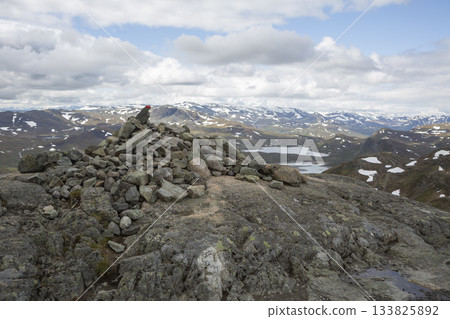 Stunning view from the summit of Synshorn mountain in Jotunheimen national park, Norway during a cloudy day 133825892