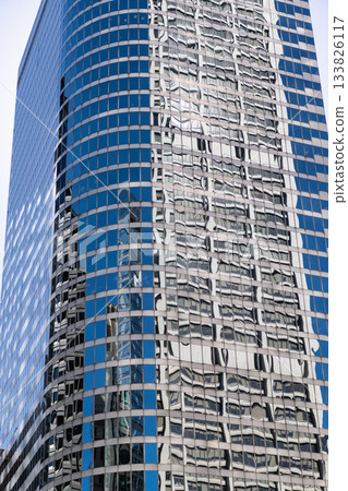 Building background. Glass building window. Architectural detail. Background of architecture. Modern glass background. Reflective glass background. Business architecture. Building architecture Building background. Glass building window. Architectural detail. Background of architecture. Modern glass background. Reflective glass background. Business architecture. Building architecture 133826117