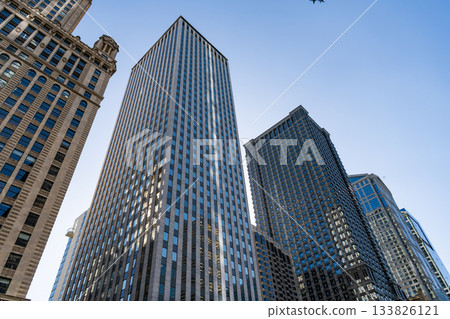 Reflective glass architecture. Architecture in business center. Building architecture. Business building. Glass building. Business city. City architecture. Modern glass building 133826121